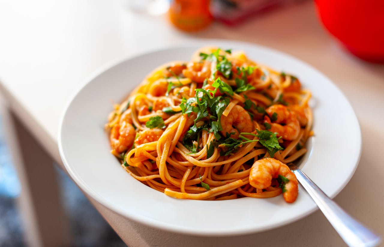 Close-up of shrimp spaghetti with parsley, perfect for a healthy Mediterranean meal.